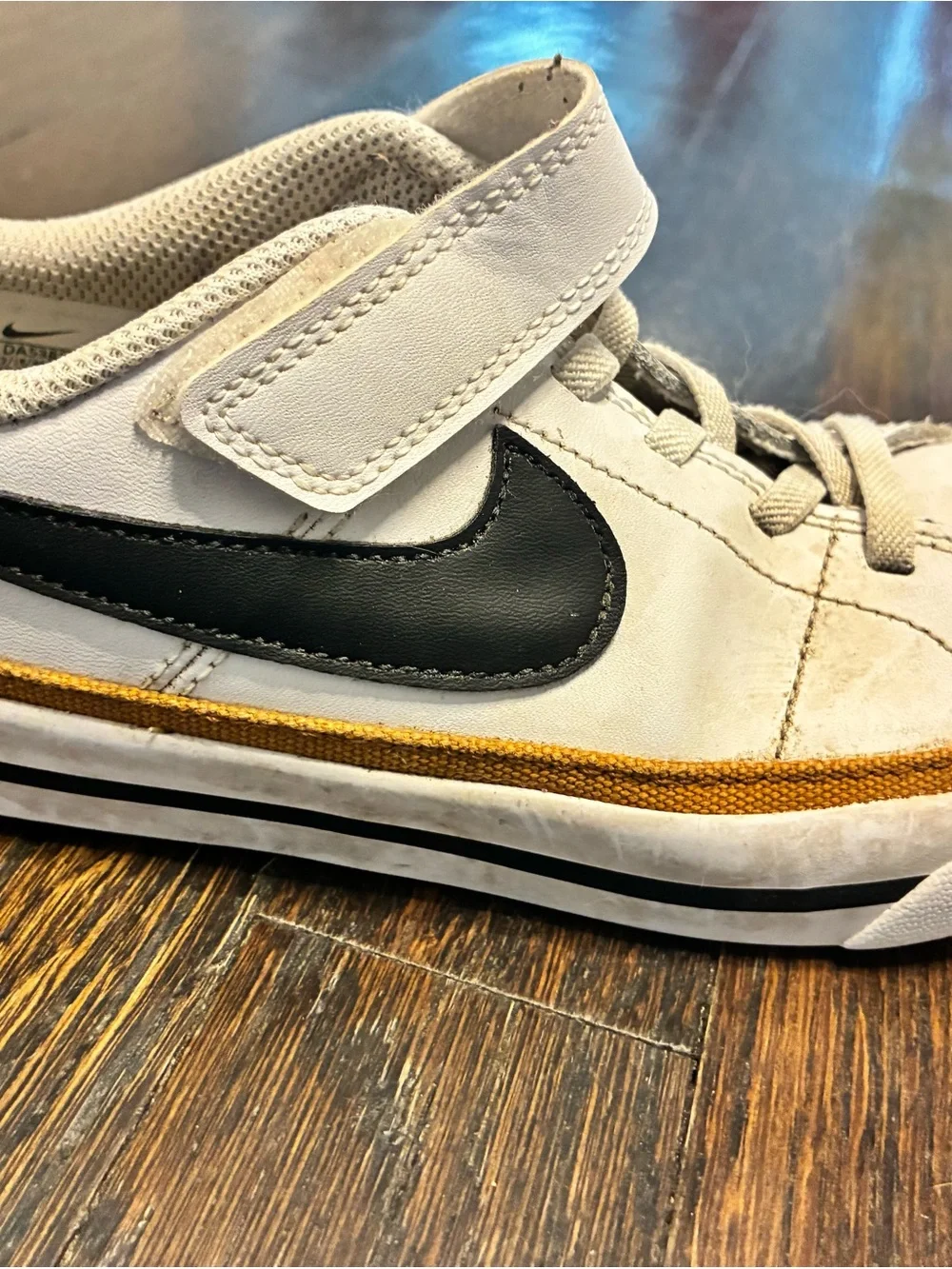 Nike Kids White Sneakers with Black Swoosh and Tan Trim